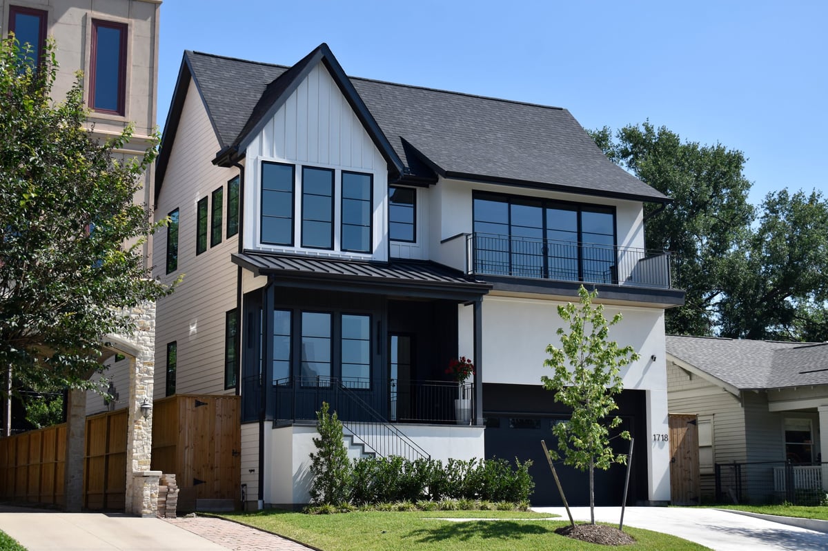 Newly built luxury modern single-family home in an upscale neighborhood under a clear blue sky, Frisco Texas