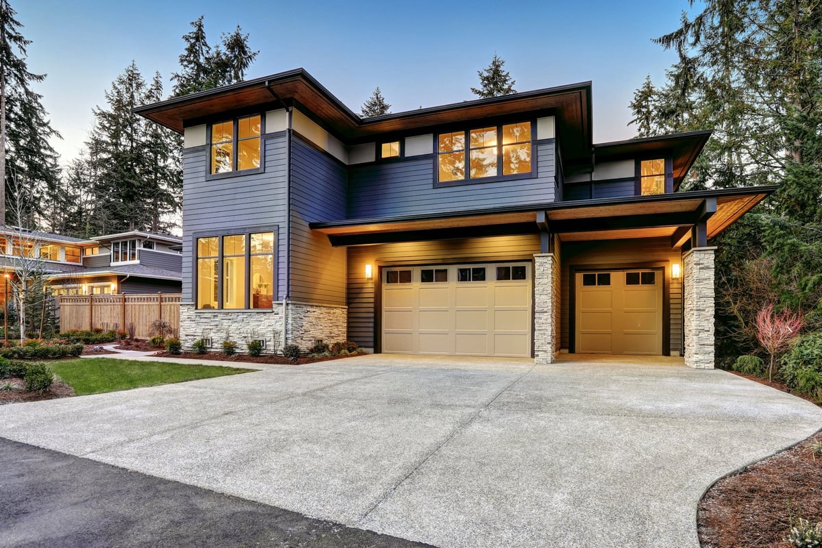 Brand new construction home with blue siding, natural stone wall trim, and two car garage in Nashville Tennessee